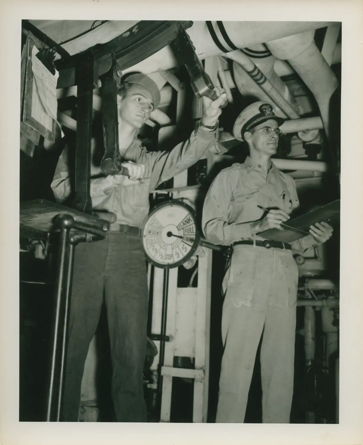 Sailors Operating Machinery and Recording Data in Engine Room, USS Petrof Bay (CVE-80), WWII