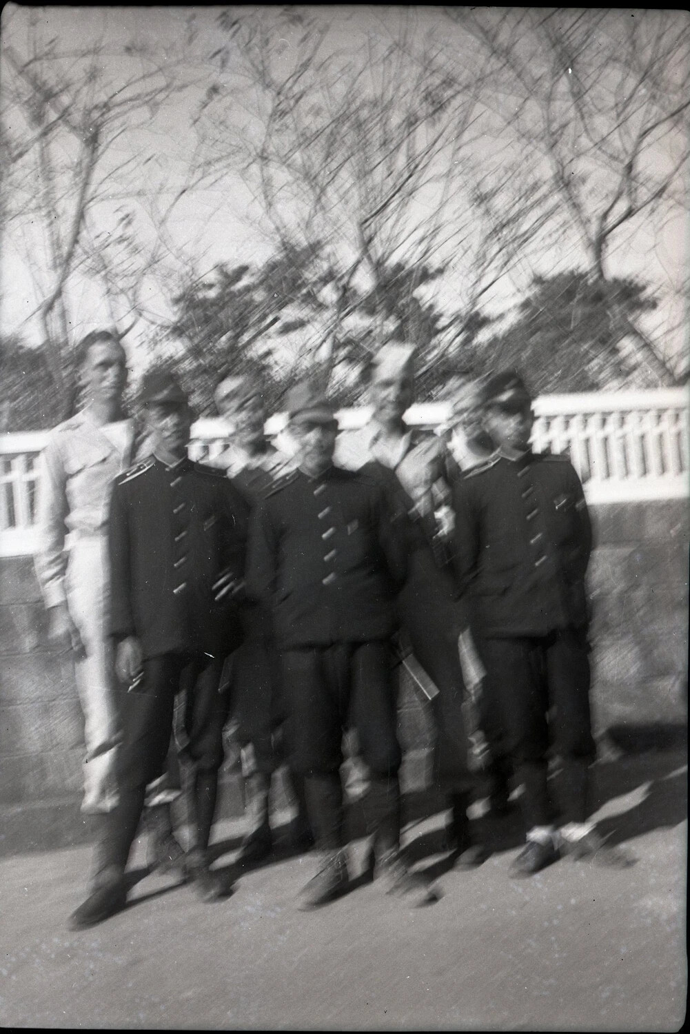 American Serviceman with Foreign Uniformed Personnel at Balustrade, Kelley Album