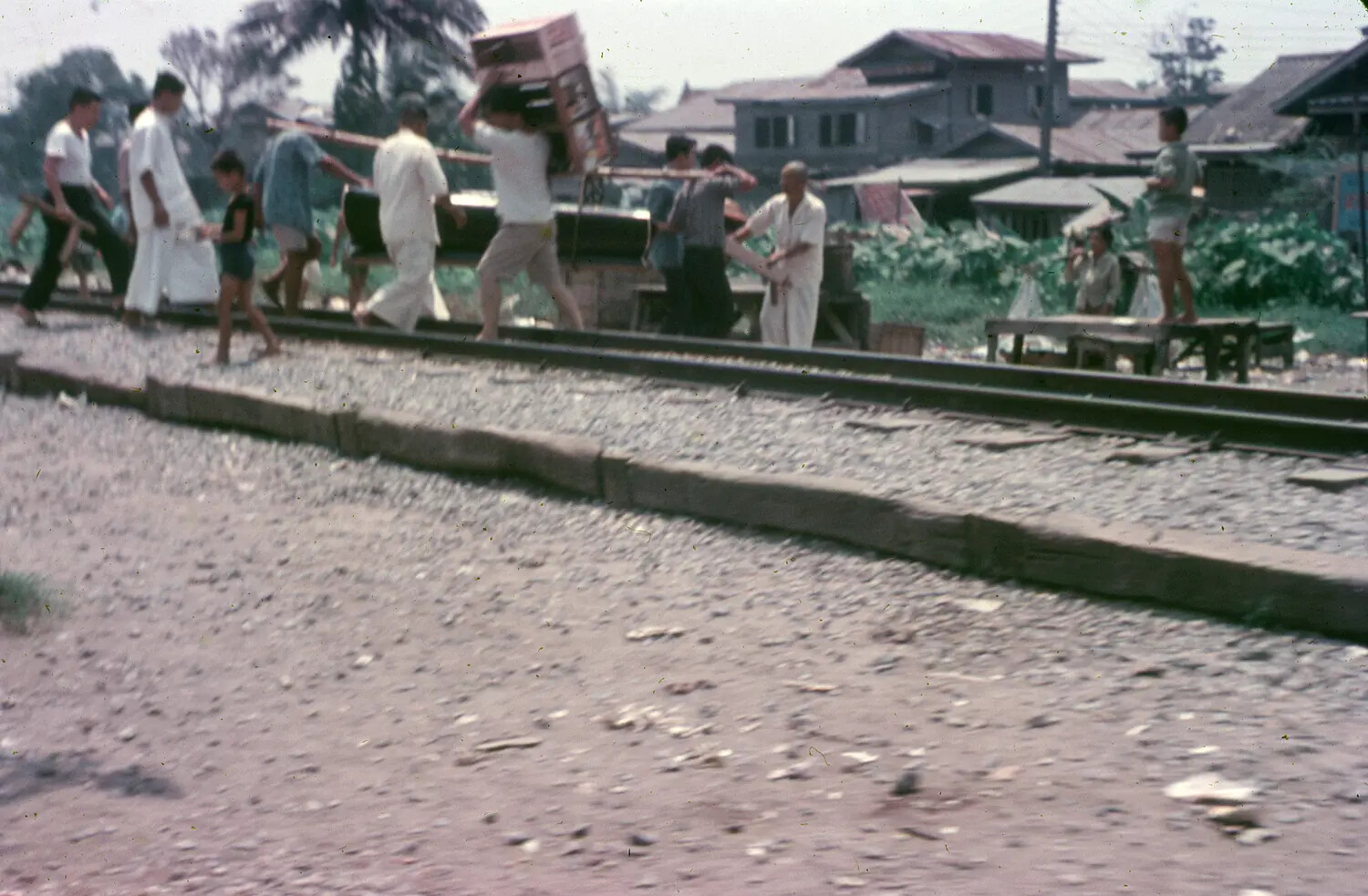 Vietnamese Civilians Along Railroad Tracks, South Vietnam, 1965