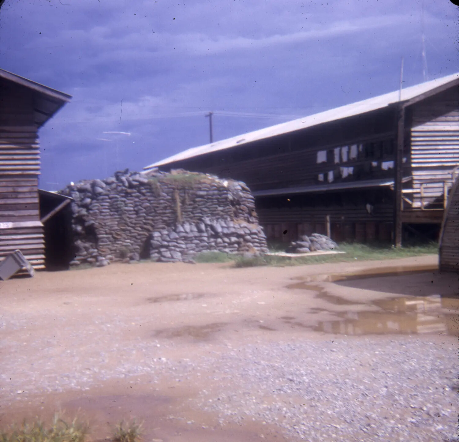 Sandbagged Bunker and Barracks at a U.S. Base Camp, Vietnam War Era