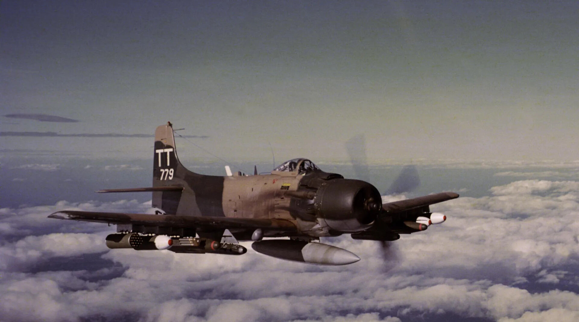 Douglas A-1 Skyraider 'TT 779' in Flight Above a Cloud Deck — Cut-Out and Retouched Banner Working File, Discarded