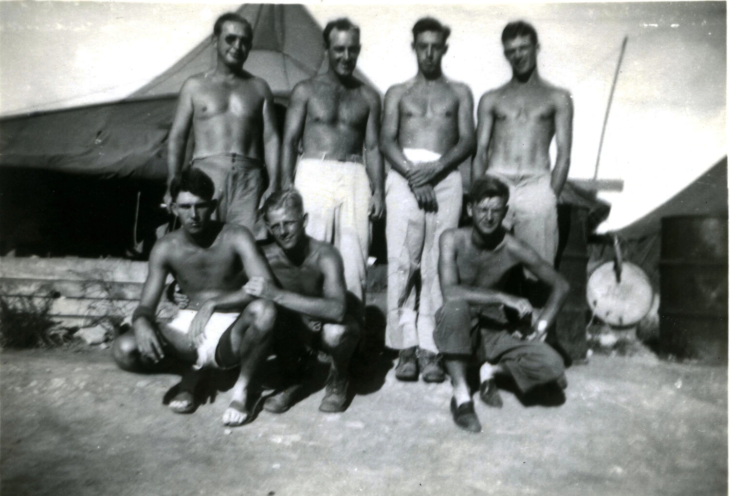 Group Portrait of Shirtless U.S. Marines at Rest Camp, Pacific Theater, WWII