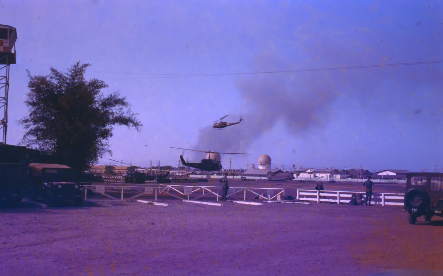 UH-1 Huey Helicopters Over Vietnamese Air Base During Tet Offensive, 1968