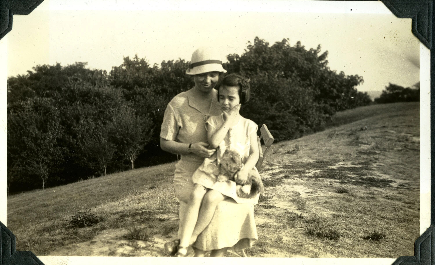 Woman and Child on a Garden Bench - Jervey Family Photo Album (Signal Corps Collection)