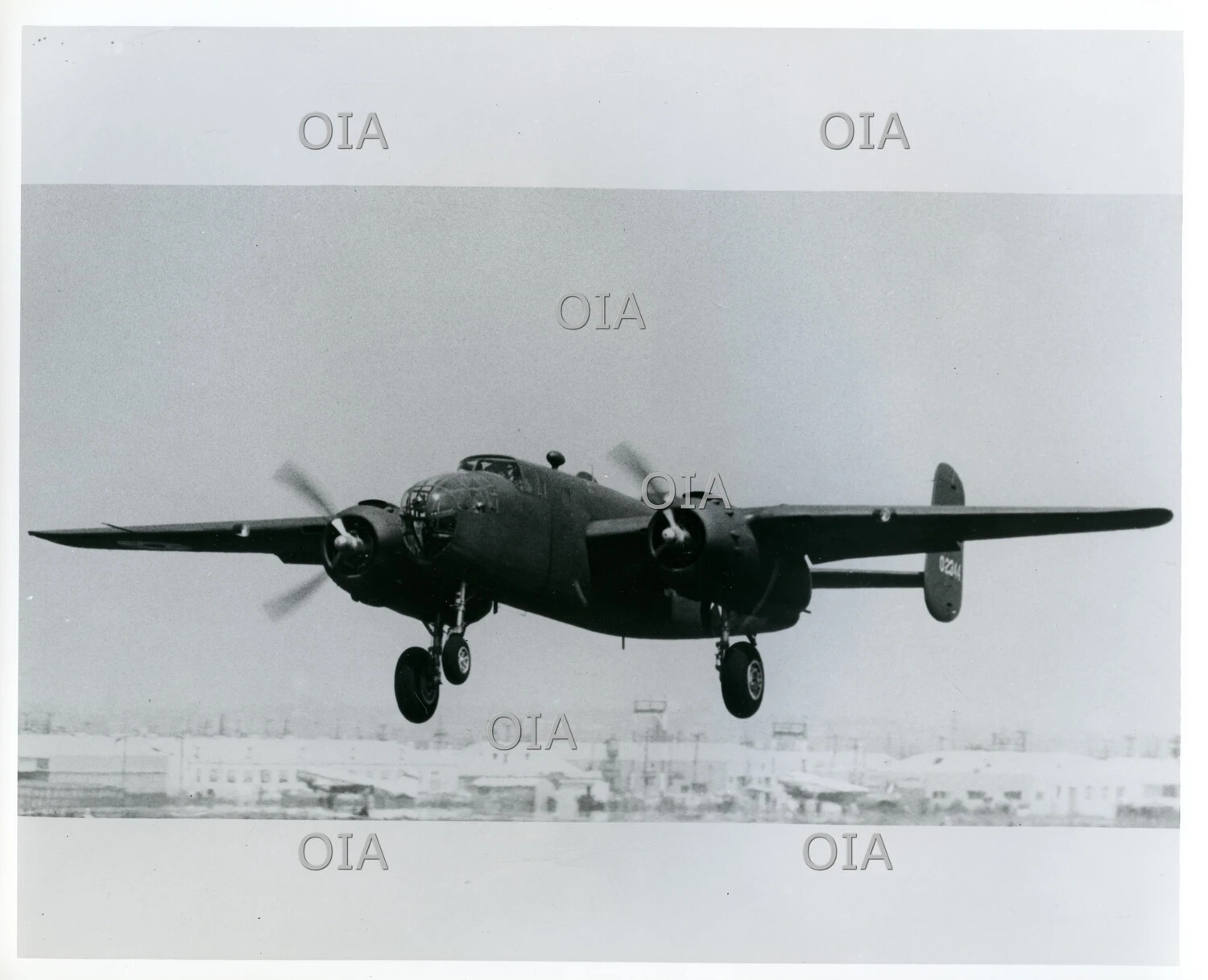 North American B-25 Mitchell Medium Bomber in Flight, Front Three-Quarter View, Landing Gear Extended