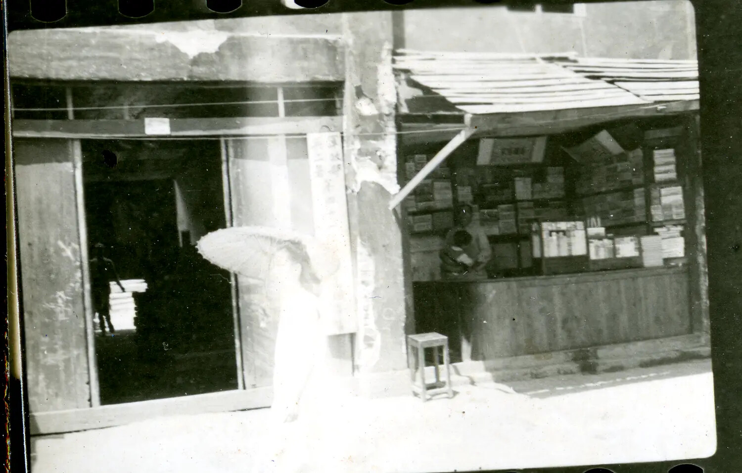 Street Scene with Market Stall and Pedestrian, China-Burma-India Theater, WWII