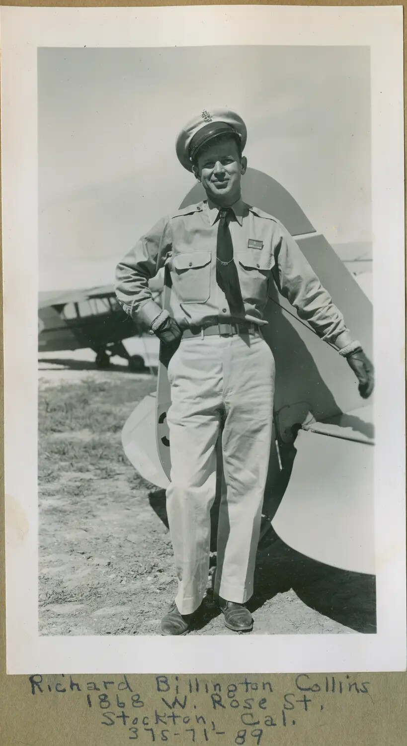 Naval Aviation Cadet Richard Billington Collins Beside Training Aircraft