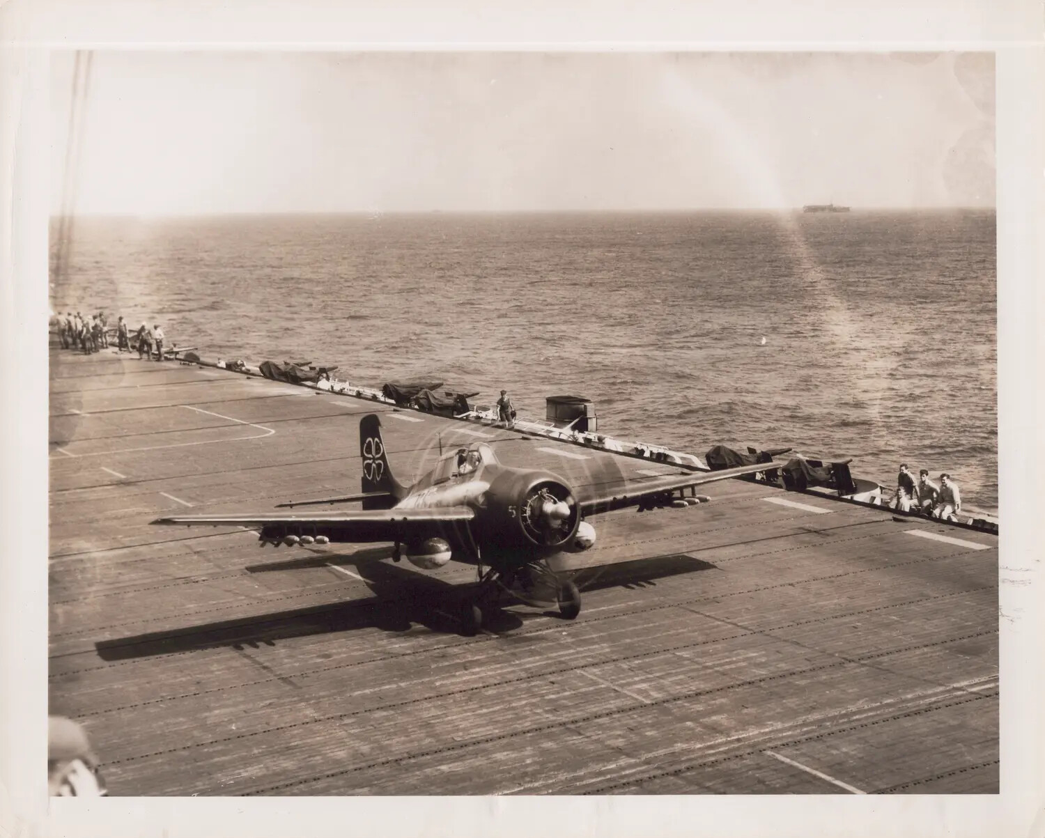 FM-2 Wildcat Fighter Launching from Flight Deck, USS Petrof Bay (CVE-80)