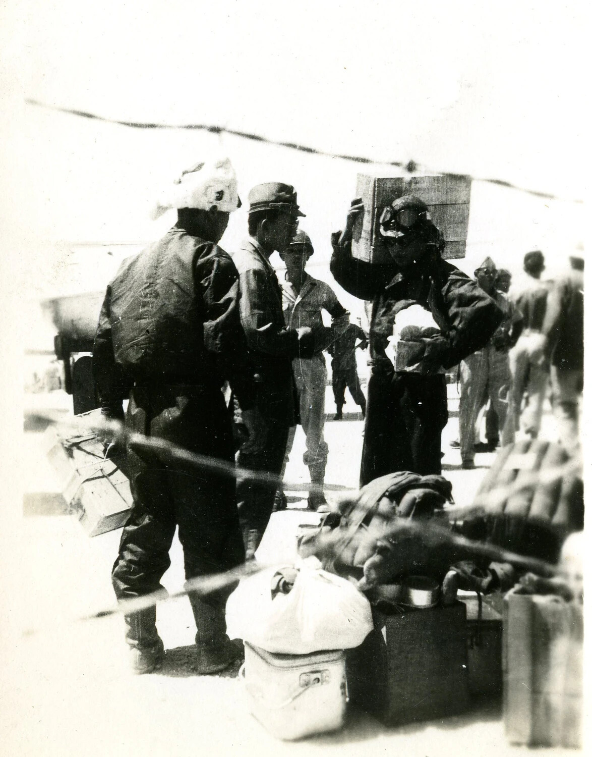 Personnel Handling Luggage and Crates on the Flight Line, Ie Shima, 19 August 1945