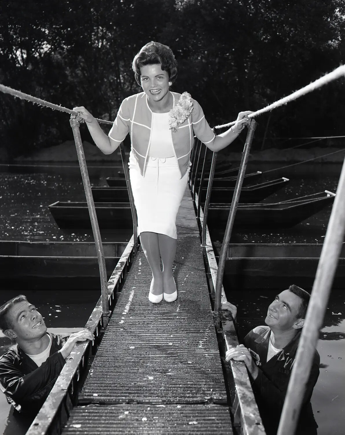 Civilian Visitor Crosses Improvised Suspension Footbridge at National Guard Summer Camp, July 1960