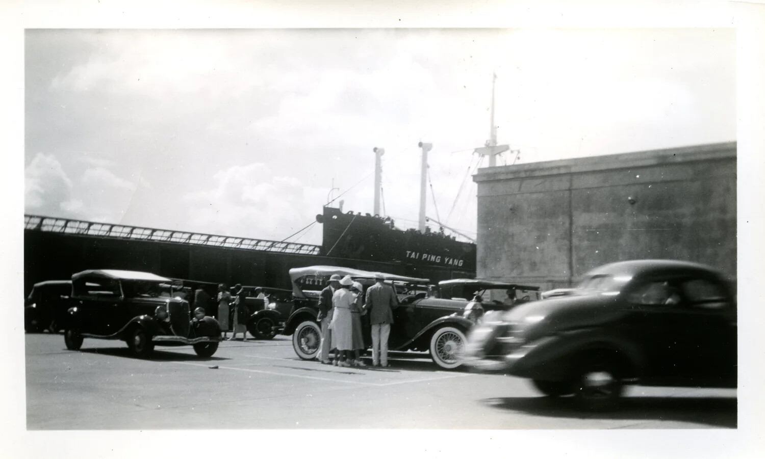 Automobiles and Dockworkers at Cristobal Pier with Merchant Ship 'Tai Ping Yang,' December 25, 1936