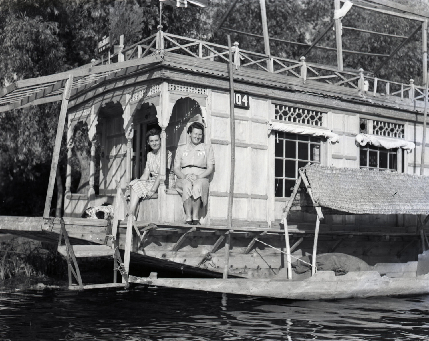 Two Women Aboard Kashmiri Houseboat 'Argonaut,' No. 104 — CBI Theater Era Travel Photograph