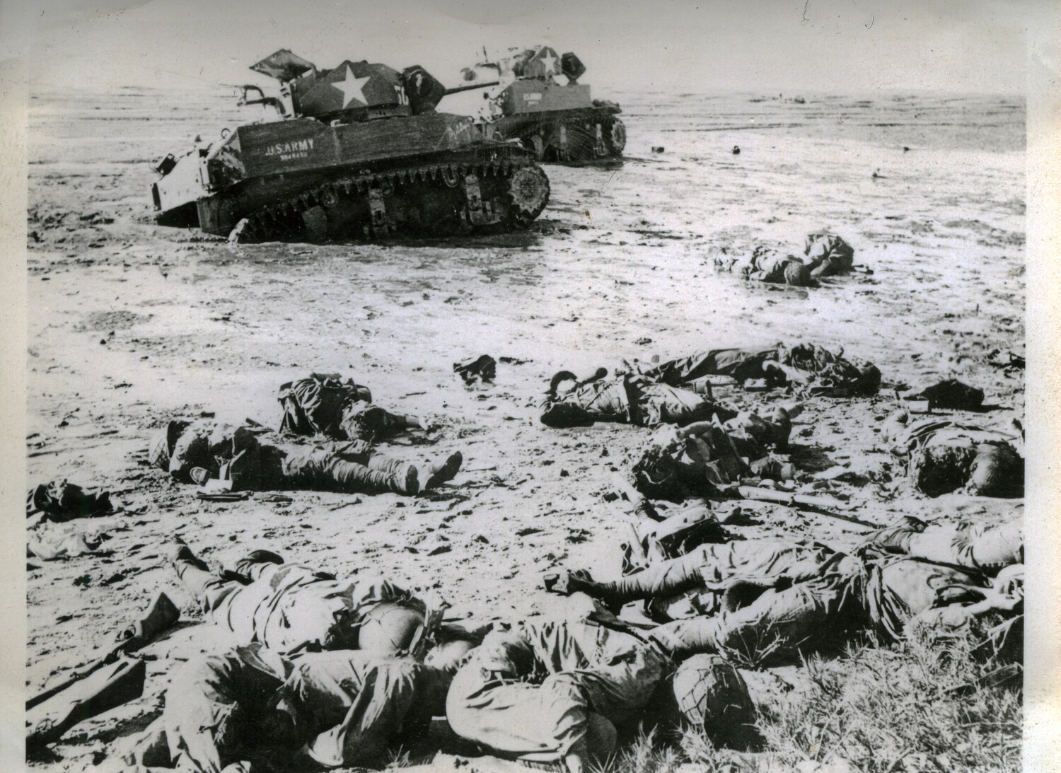 Fallen Japanese Soldiers on a Beach with U.S. Army Sherman Tanks, Battle of Okinawa, 1945