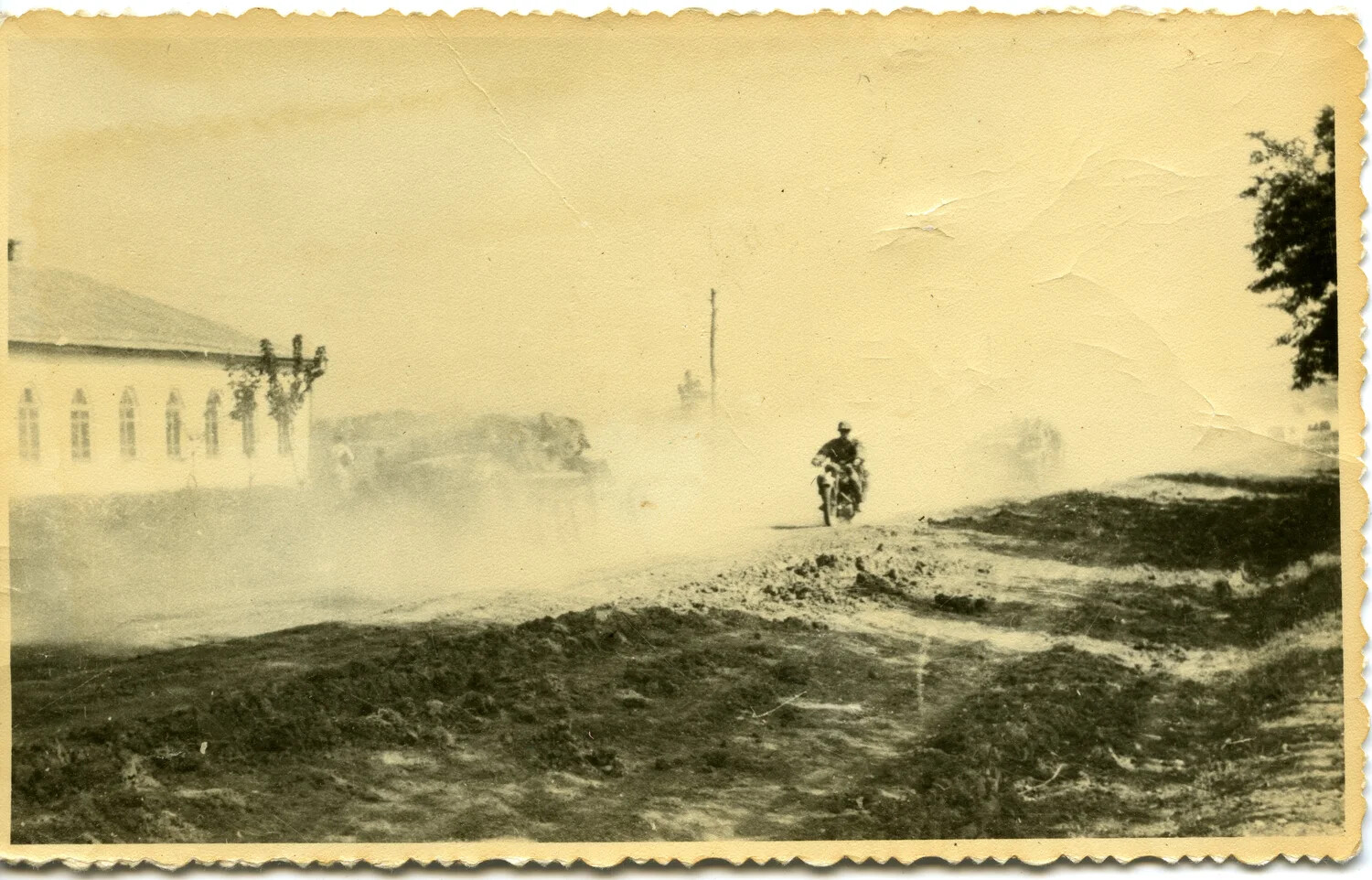 German Military Motorcyclist on Dusty Village Road, Eastern Front, WWII