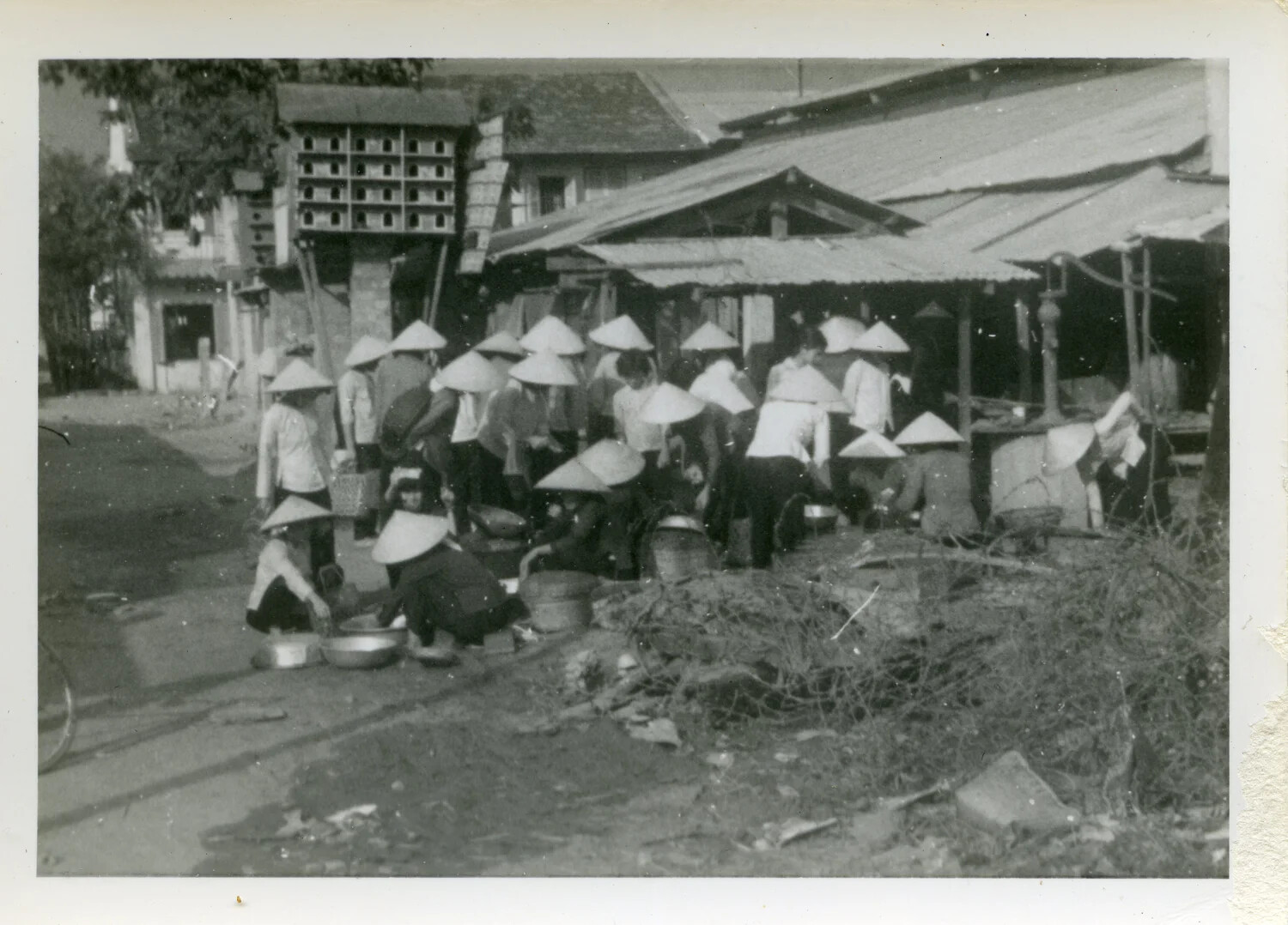 Communal Washing and Domestic Activity on Village Street, South Vietnam, 1967