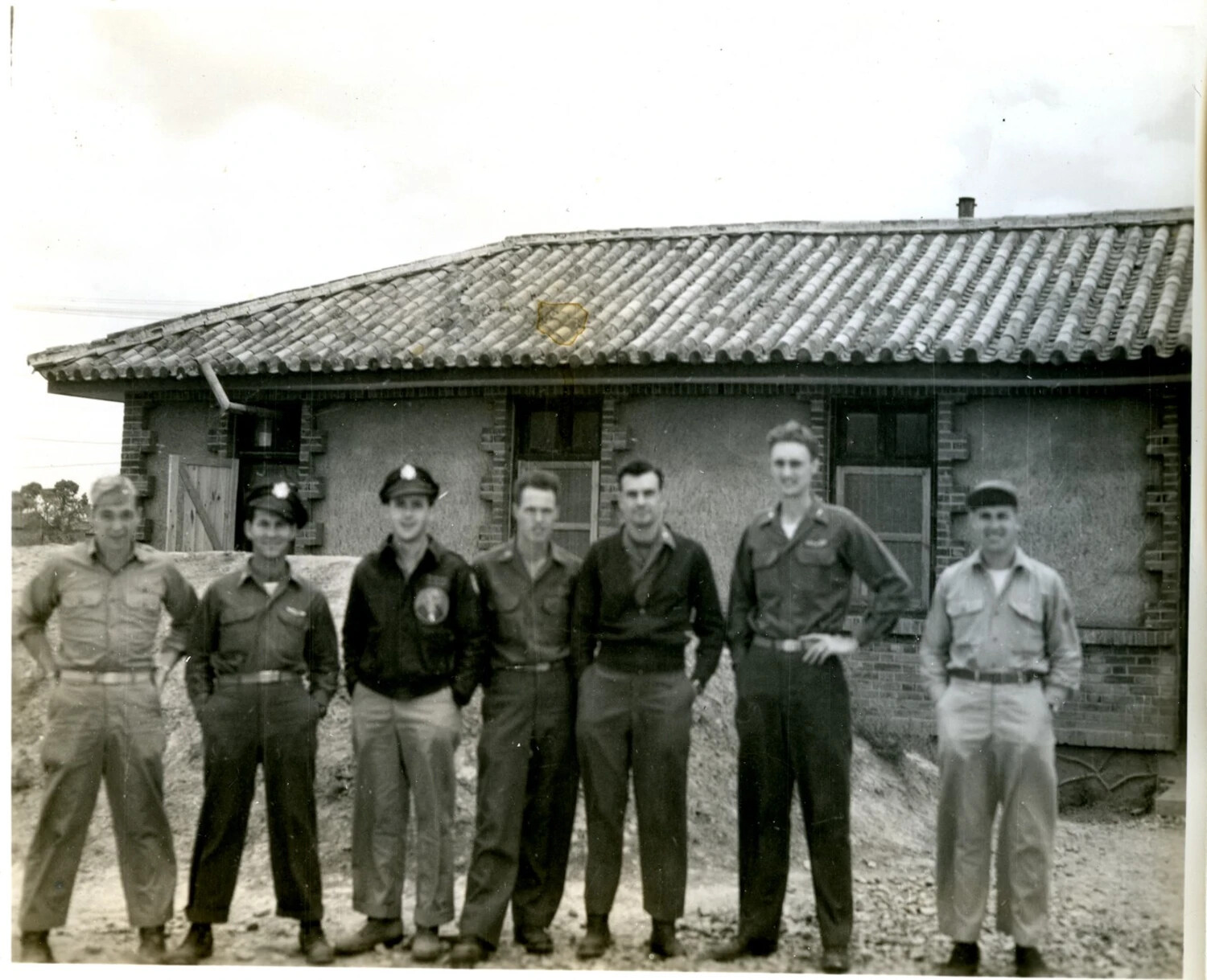Group Portrait of Servicemen at a Tile-Roofed Building — Likely China-Burma-India (CBI) Theater, World War II