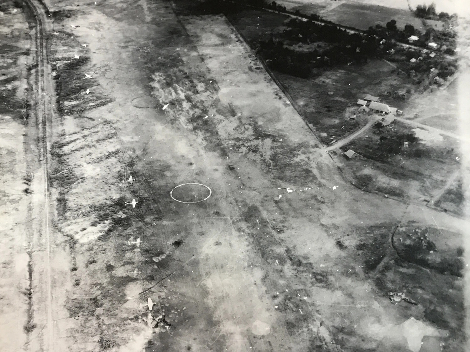 Aerial Reconnaissance Photograph of Airfield Dispersal Area with Parked Aircraft and Target Circle