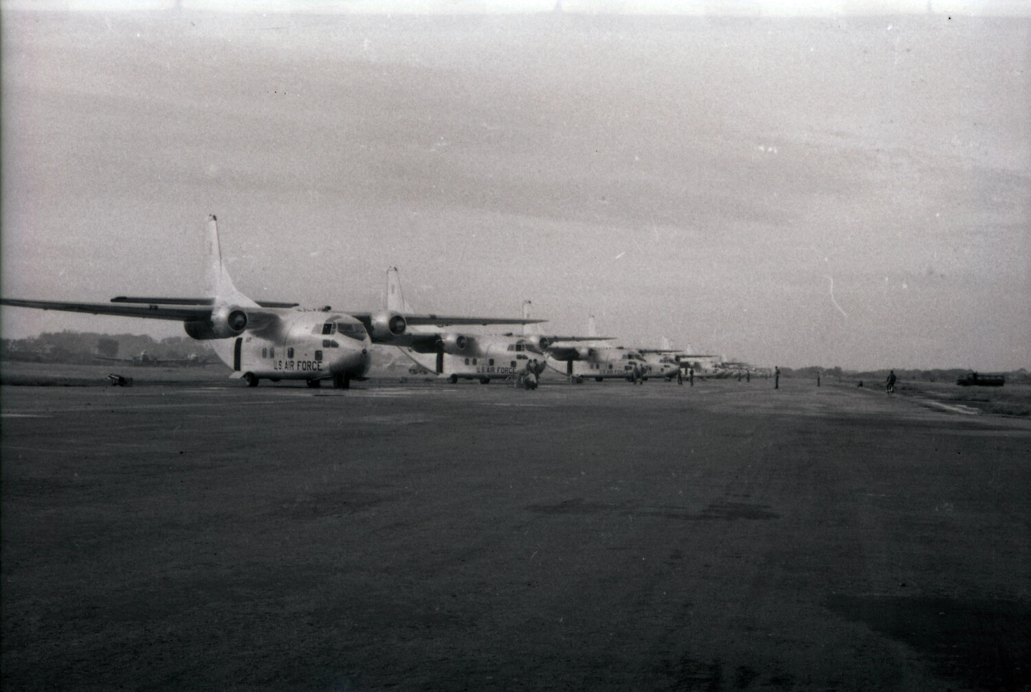 Line of USAF Fairchild C-123 Provider Transports on Flight Line Ramp