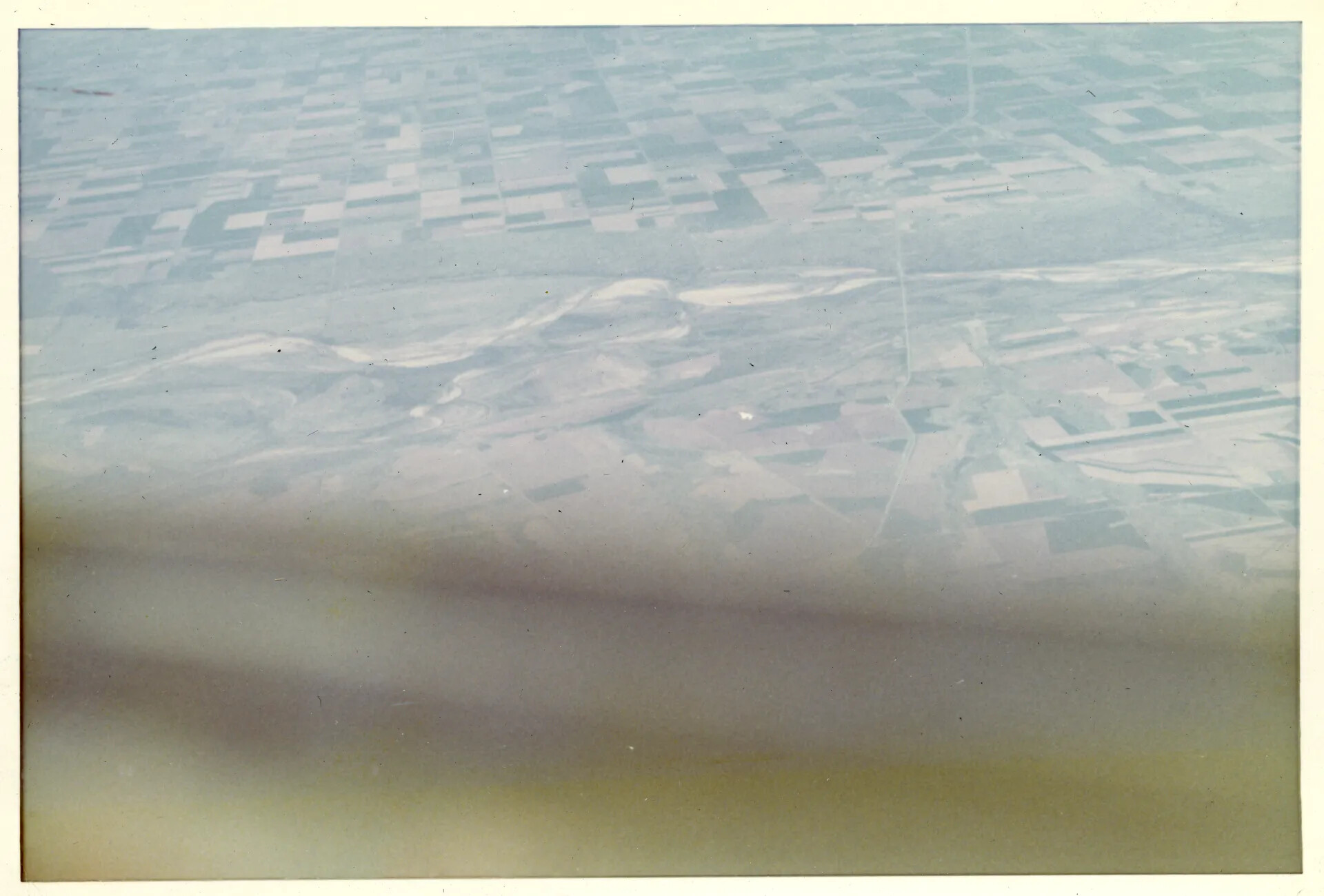 Aerial View of Farmland from Aircraft Window