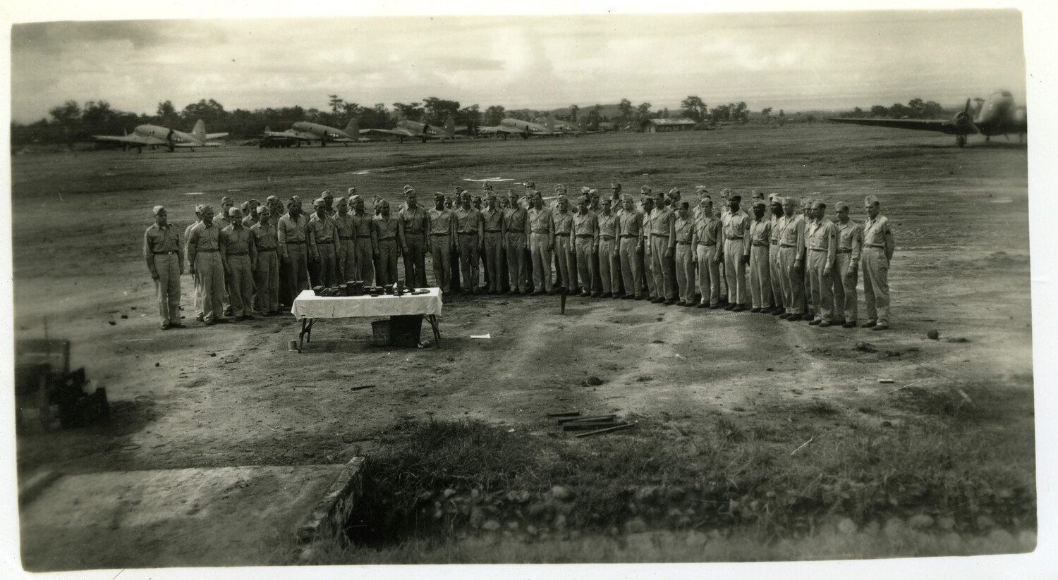Formation Ceremony on Airfield with Parked Fighter Aircraft, Pacific Theater, WWII