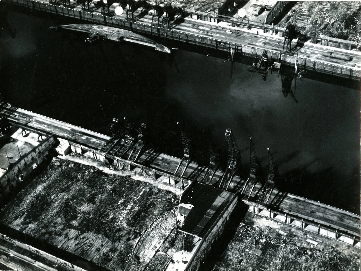 WWII Aerial Reconnaissance Photograph - Capsized Vessel and Damaged Dockyard, Bremen/Wesermünde Harbor, Germany