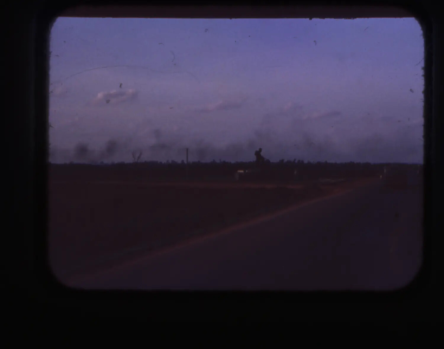 Dusk View Along Roadway with Smoke on Horizon, Vietnam War Era, Cam Ranh Bay Area