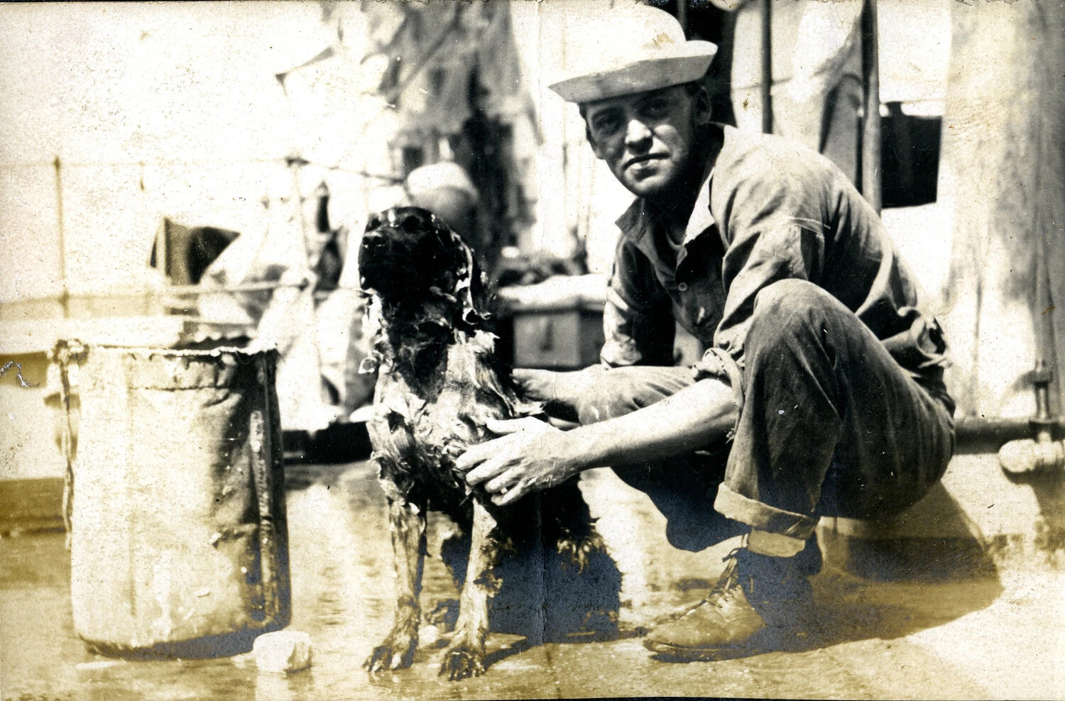 Sailor with Ship's Mascot Dog, Nicknamed 'Admiral Togo,' U.S. Navy Cruiser, c. 1905-1907
