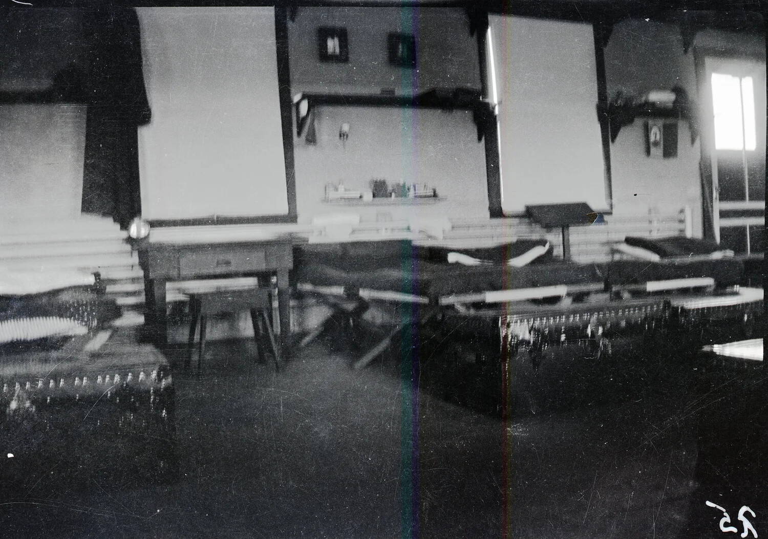 Interior View of WWI-Era Barracks Billet, France/England, Row of Cots and Personal Effects