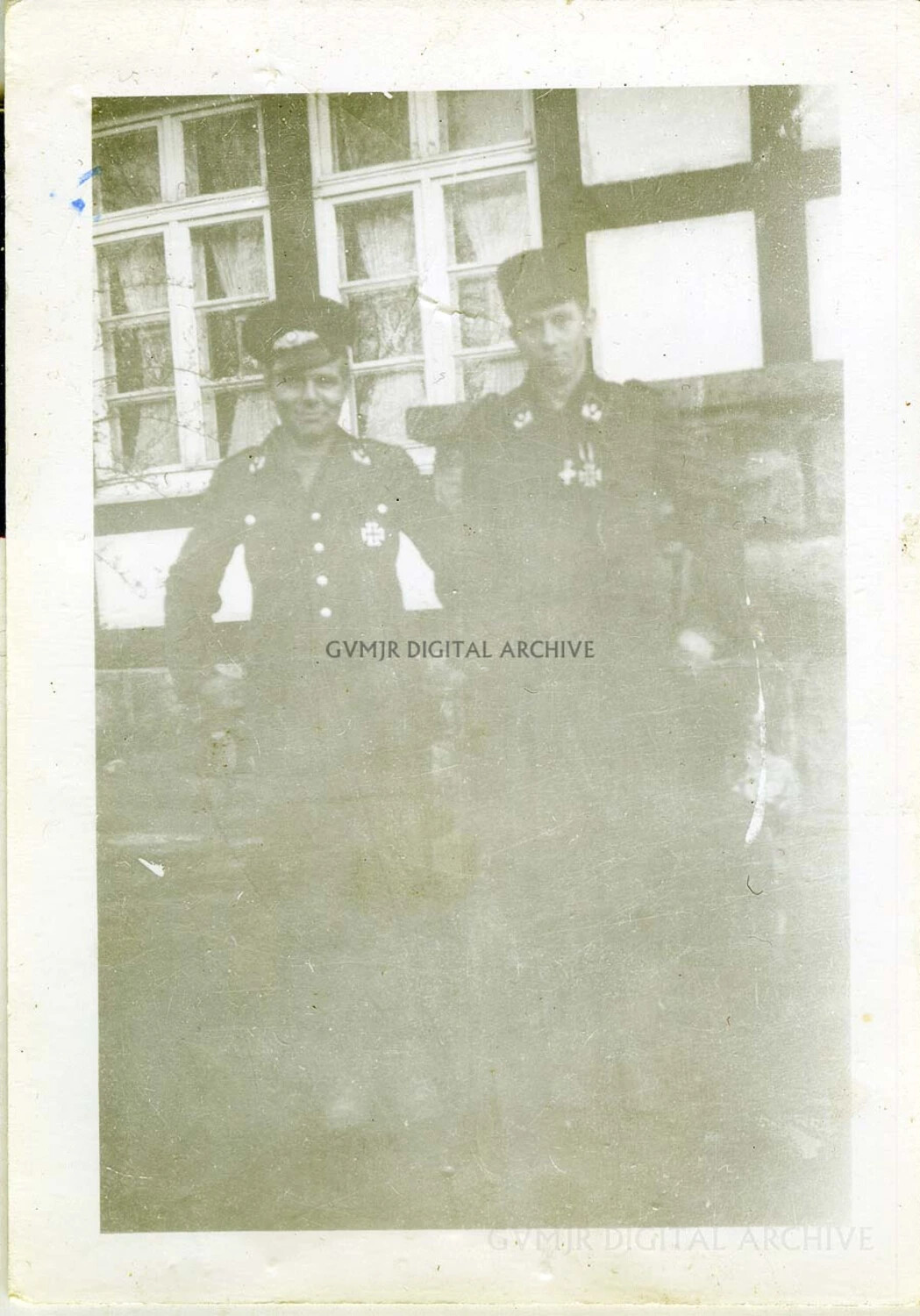 Two U.S. Soldiers in Service Uniform Before Half-Timbered Building, European Theater, WWII