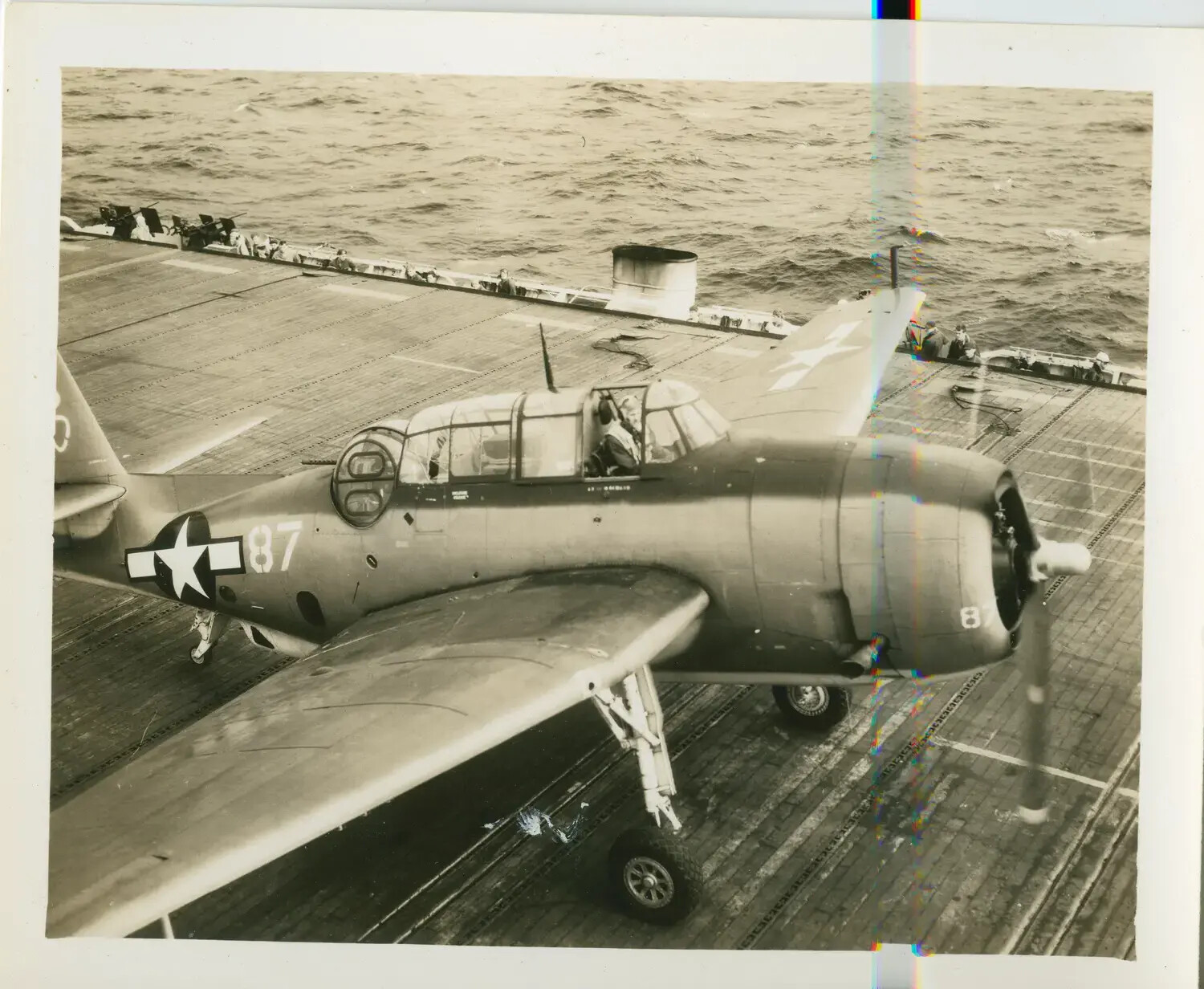 TBM/TBF Avenger Torpedo Bomber No. 87 on Flight Deck, USS Petrof Bay (CVE-80)