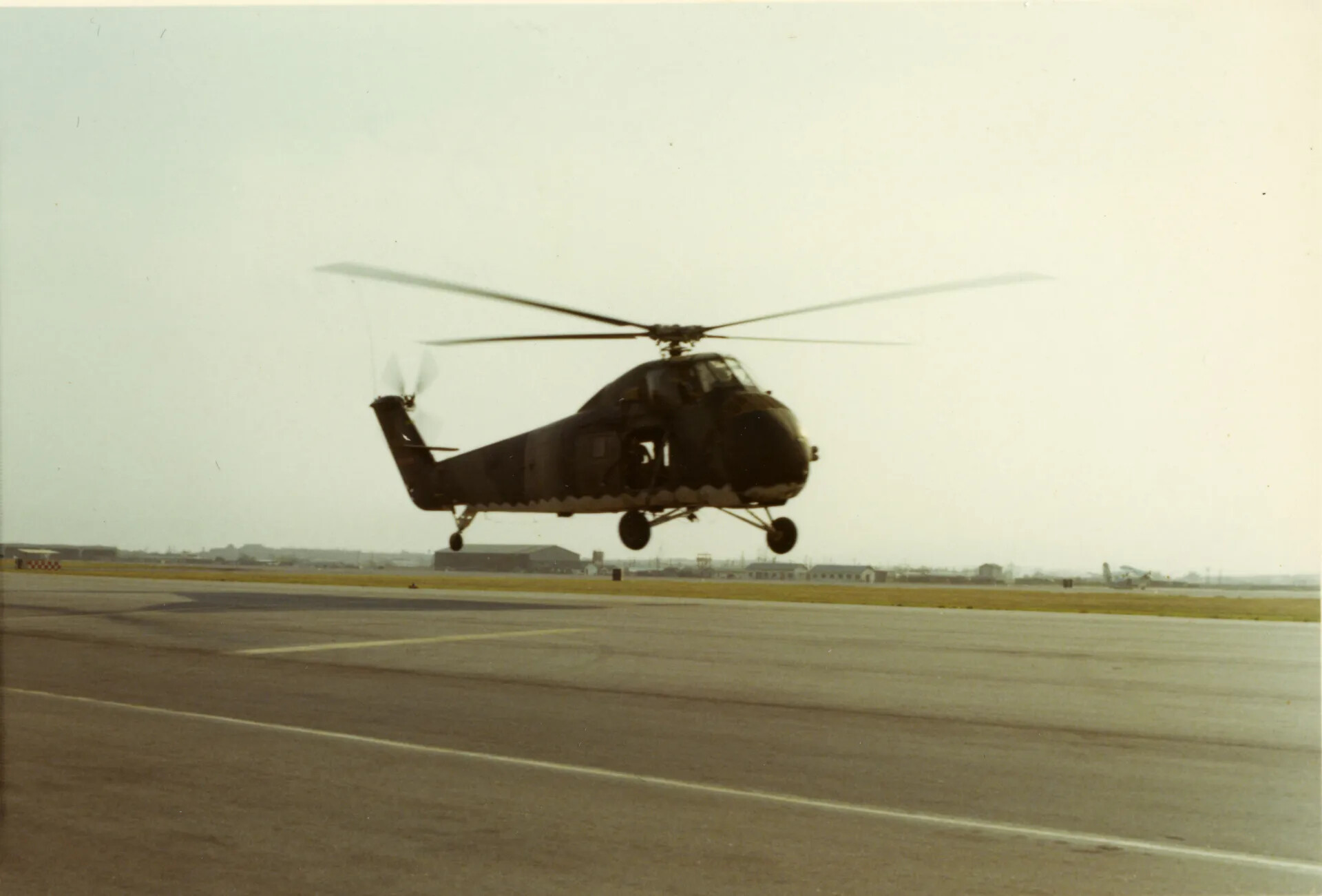 Sikorsky H-34 Helicopter on Approach, Vietnam-Era Airfield