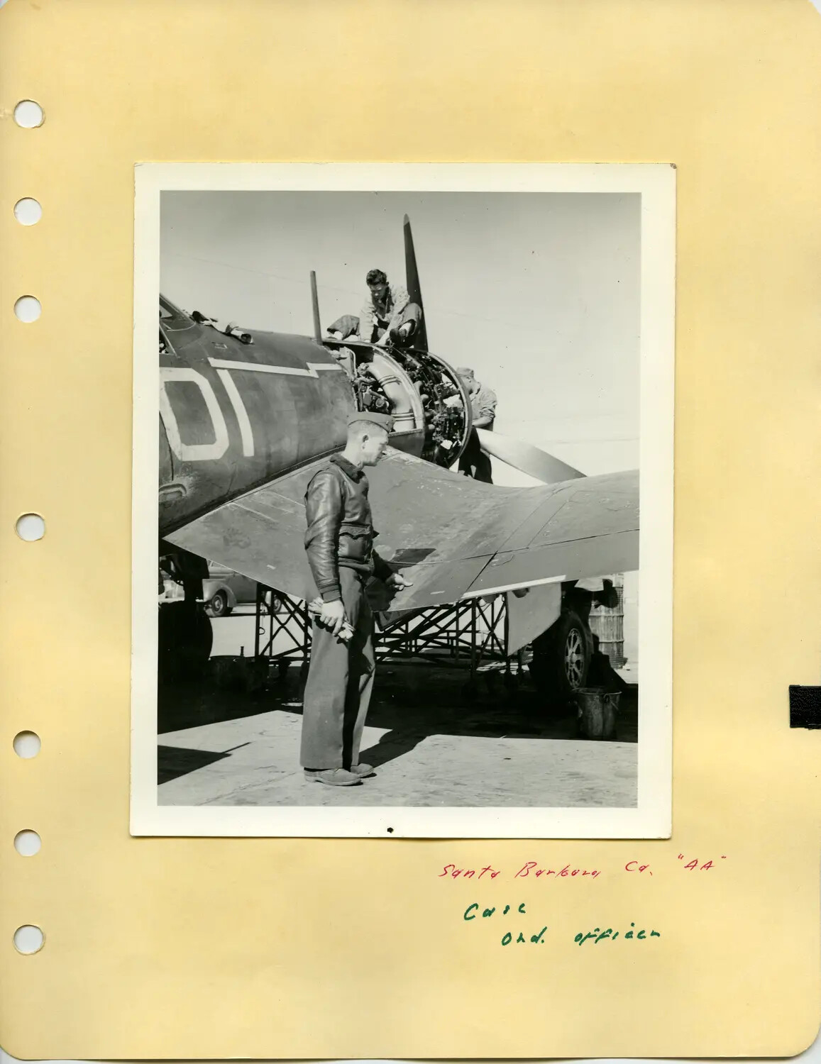 Naval Aviator and Ground Crew with Aircraft Undergoing Engine Maintenance, Edward P. McAleer Album, WWII Era