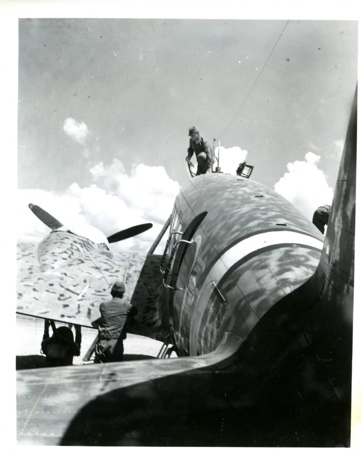 Ground Crew Servicing a Camouflaged C-46 Commando Transport, China-Burma-India Theater, World War II