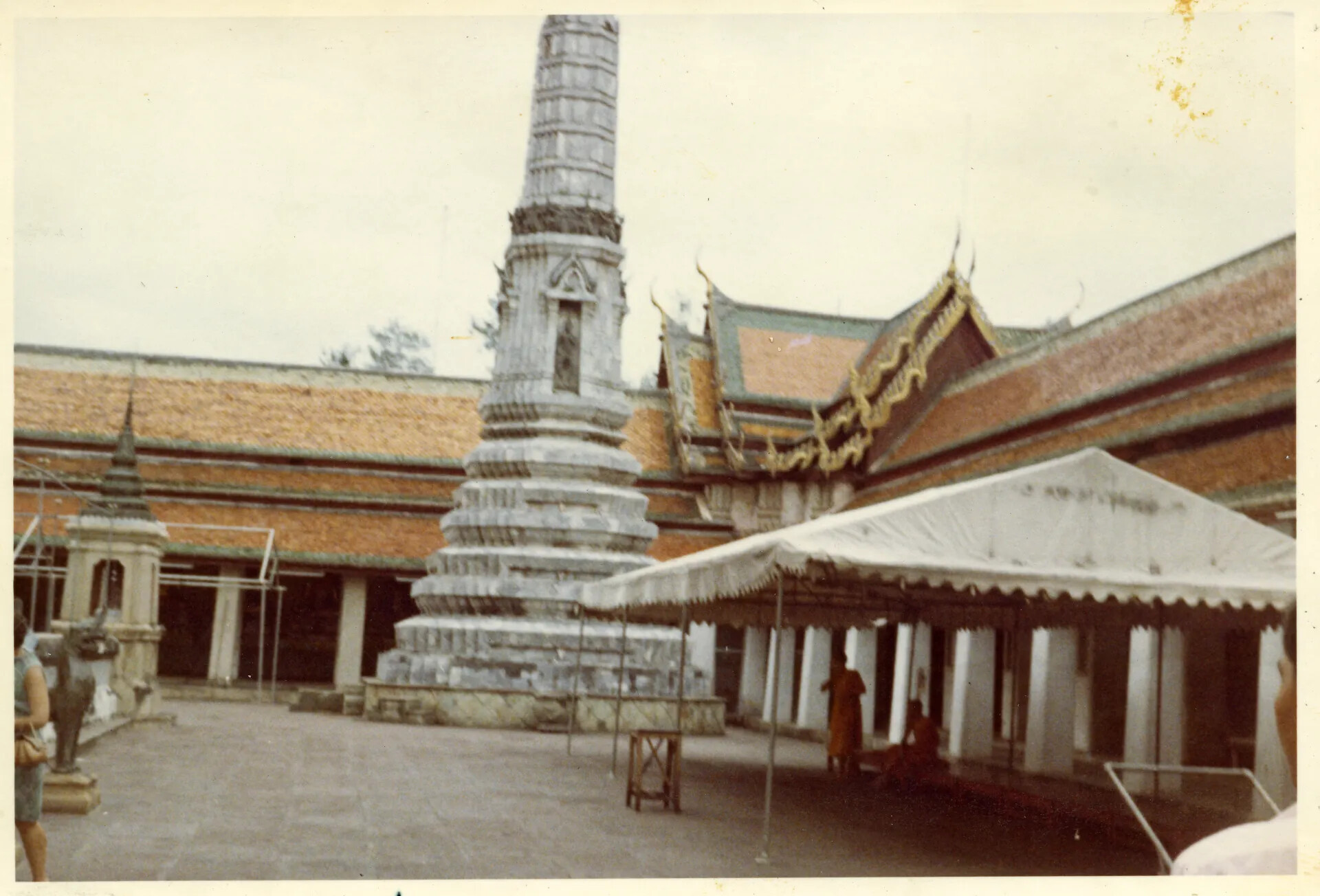 Temple Courtyard with Chedi Spire, Monks, and Canvas Awning, Bangkok, Thailand