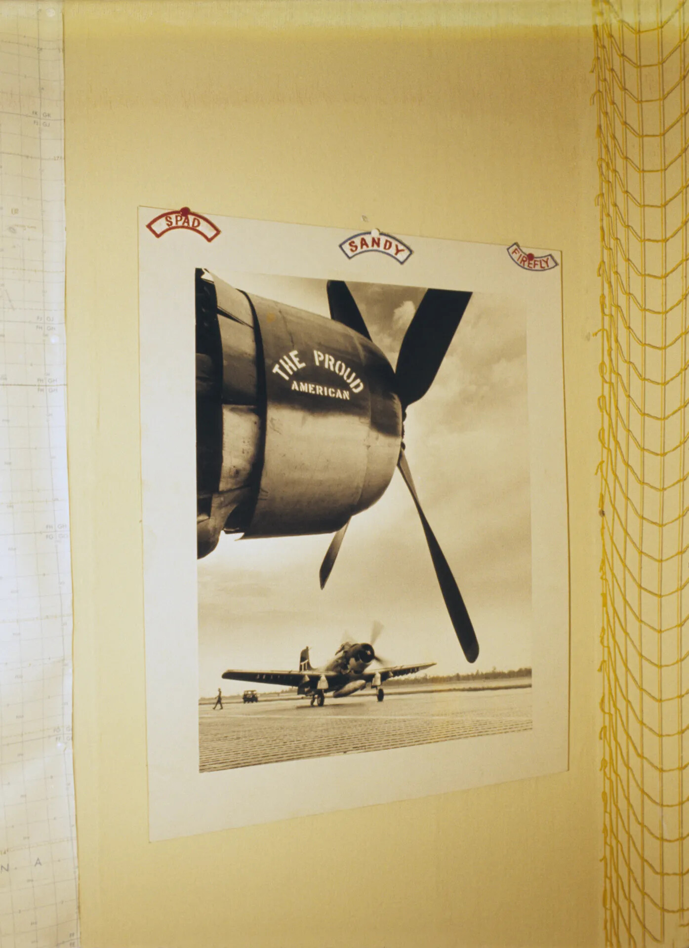 Wall Display of A-1 Skyraider Photograph with 'SPAD,' 'SANDY,' and 'FIREFLY' Tab Patches