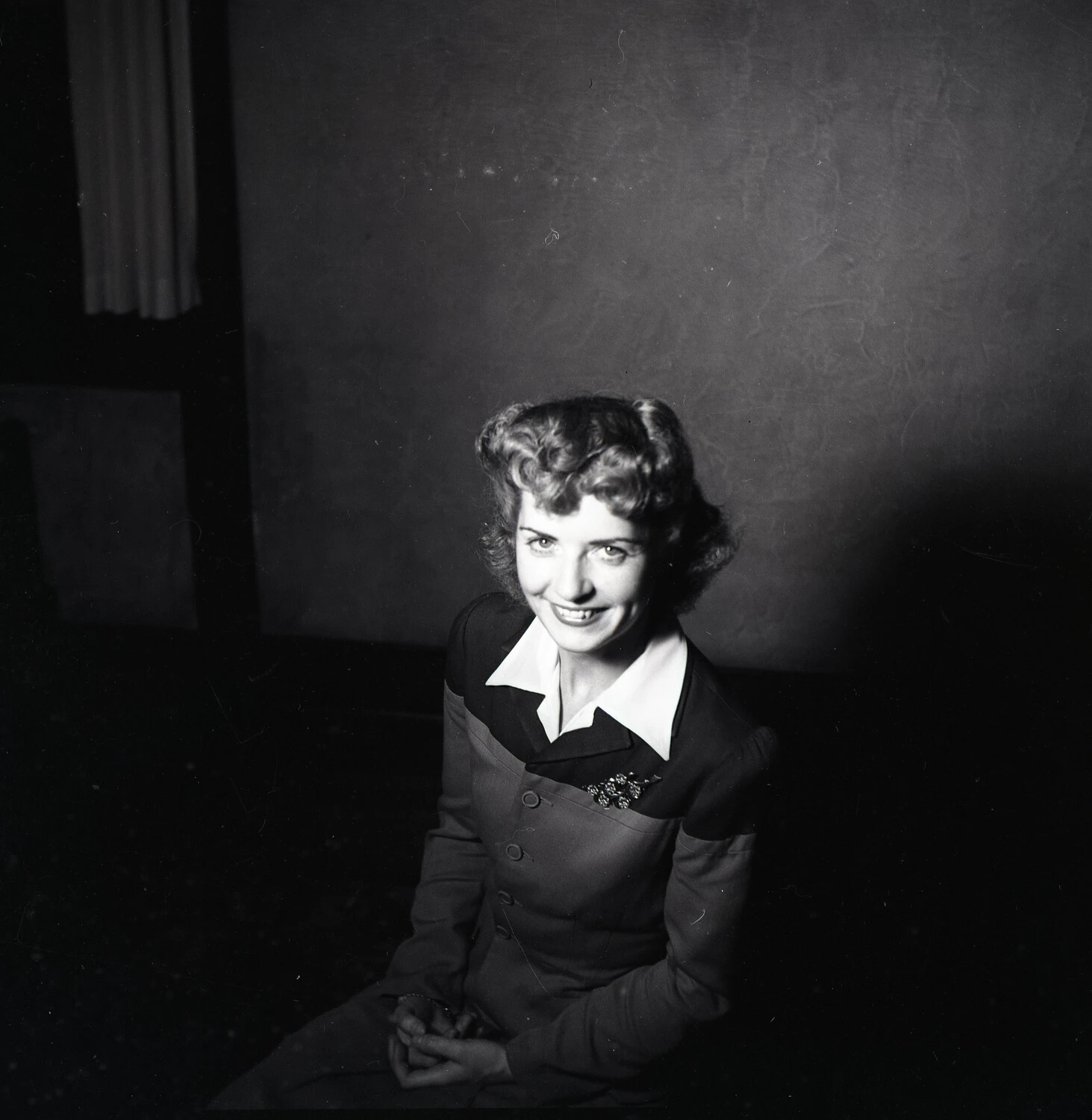 Informal Portrait of a Young Woman Seated Indoors, Smiling