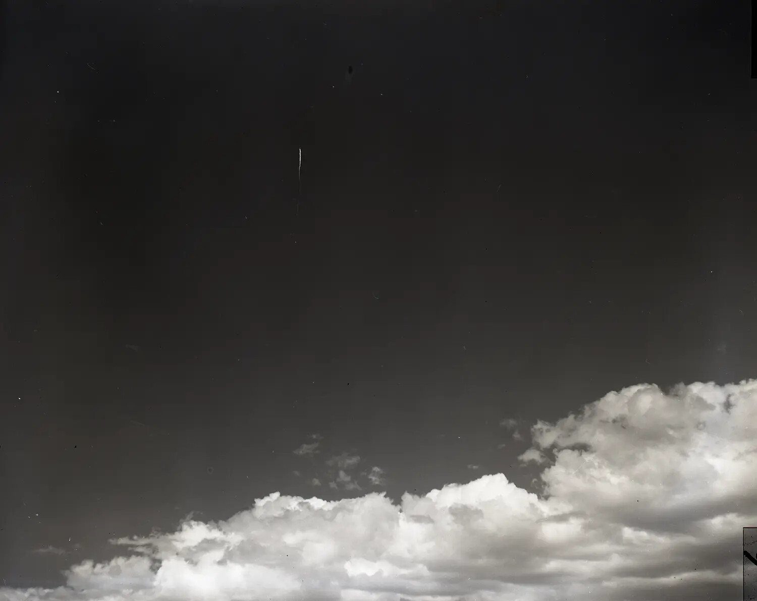 Sky Study with Faint Vertical Trail, Possible Distant Missile Ascent