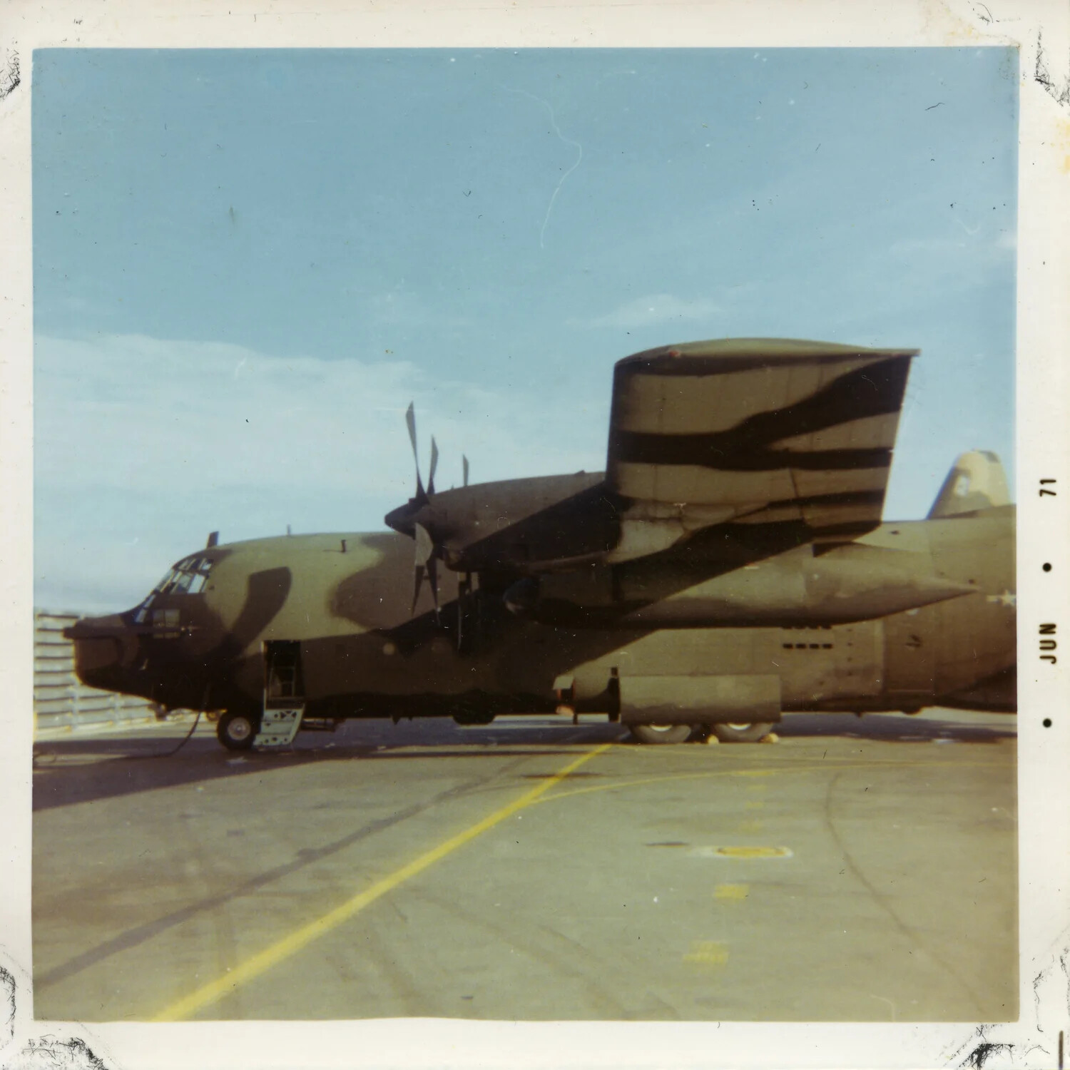 USAF C-7A Caribou Transport Aircraft on Airfield Ramp, South Vietnam, June 1971