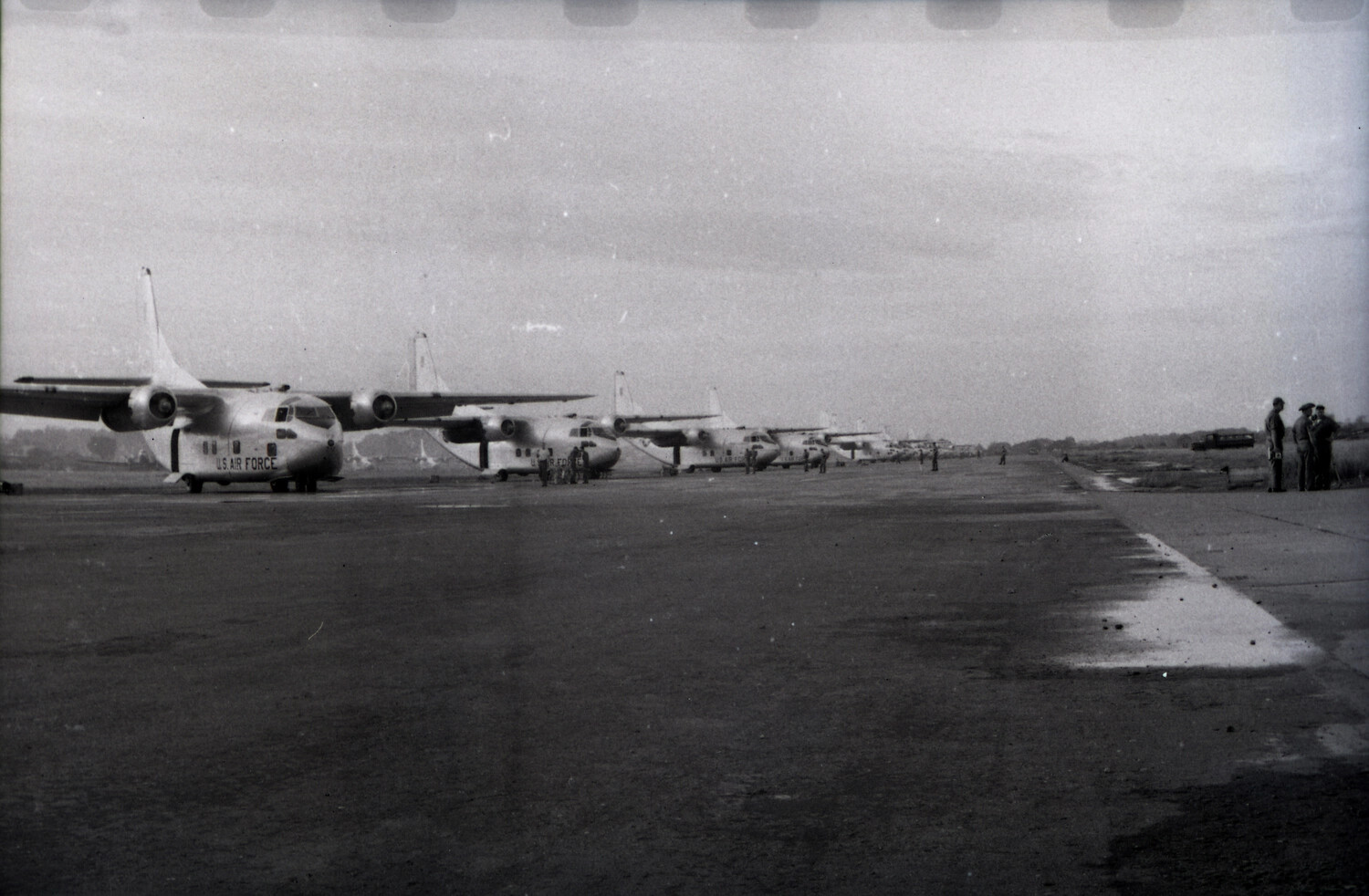 Flight Line of Fairchild C-119 Flying Boxcars with Ground Personnel