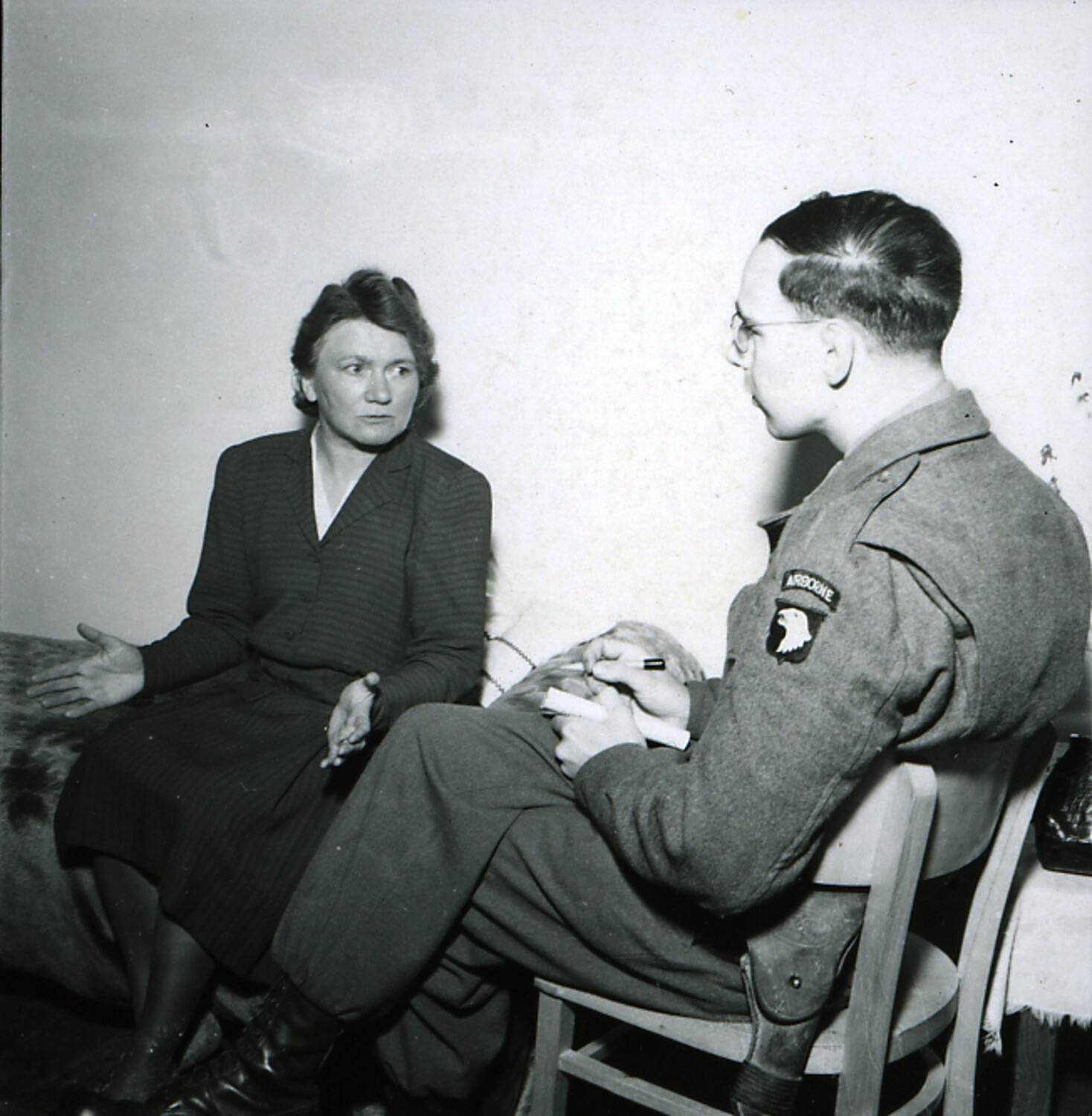 101st Airborne Division Soldier Interviewing Woman Identified as Hitler's Sister, Germany, 1945