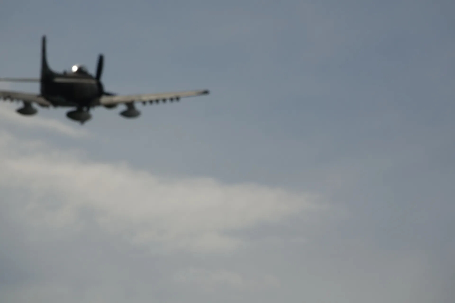 Propeller Attack Aircraft in Flight, May 2019 Reunion Event (Motion-Blurred)