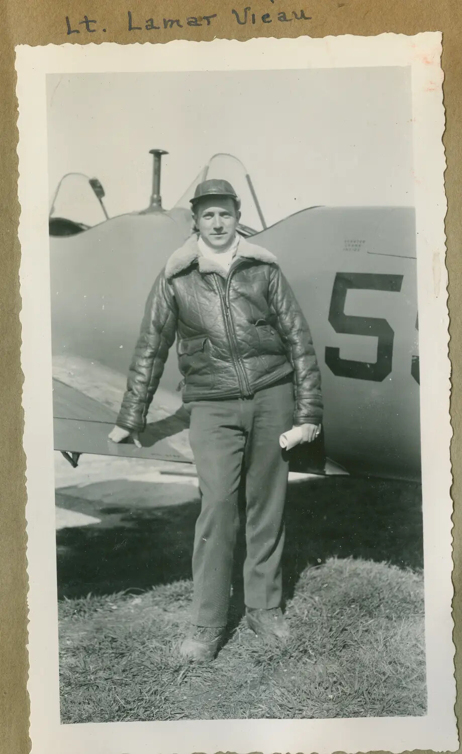 Portrait of Lt. Lamar Vieau with Biplane Trainer, U.S. Navy Flight Instructor, c. 1941-1943