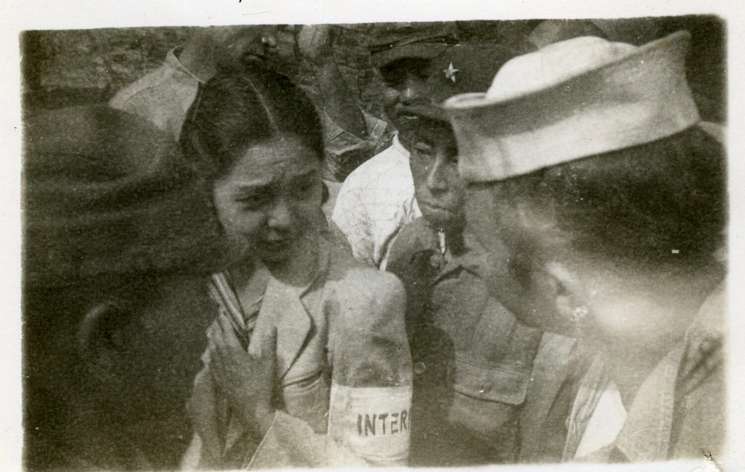 Japanese Interpreter and U.S. Sailor in Close Group Portrait, Occupied Japan