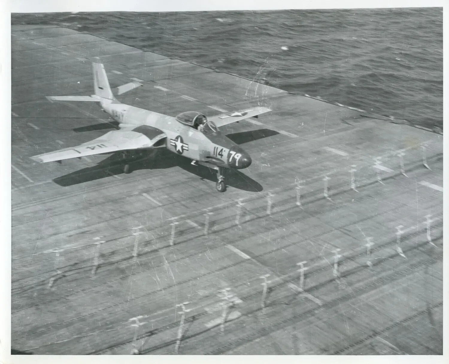 U.S. Navy Carrier Jet Fighter '114/79' on Flight Deck, 1950s Era