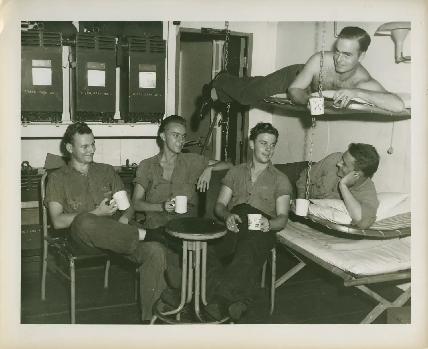 Off-Duty Crewmen Sharing Coffee Below Decks, USS Petrof Bay (CVE-80), WWII