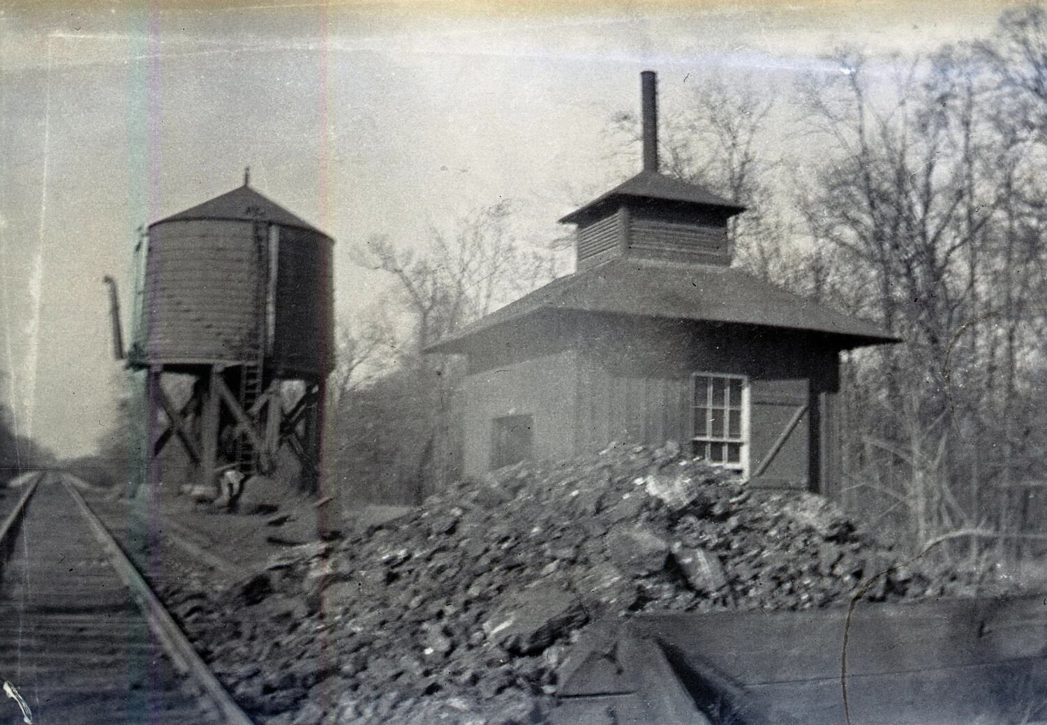 Railroad Water Tower and Trackside Building with Coal Pile, WWI Era
