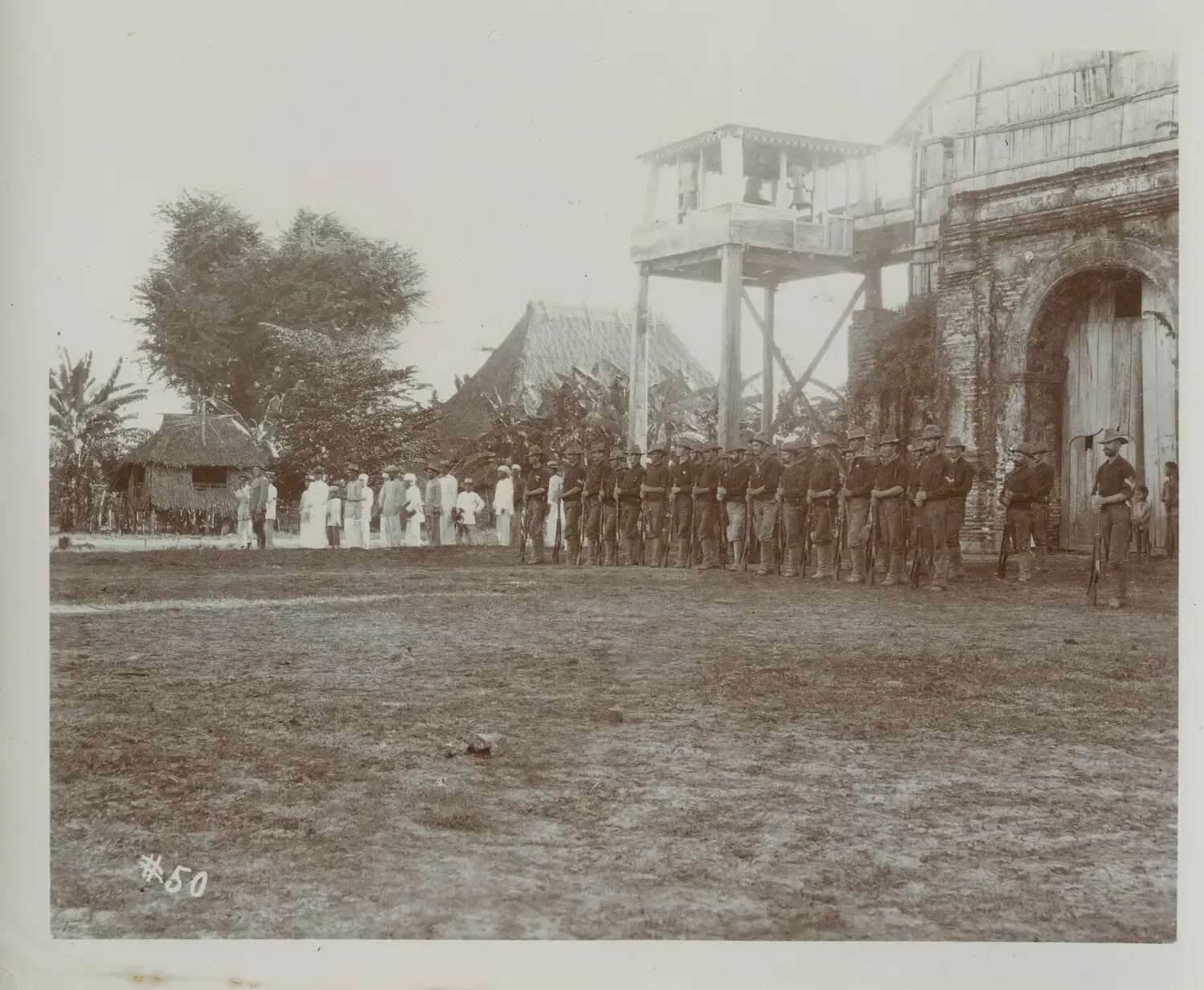 American Soldiers in Formation Before Ruined Church and Wooden Bell Scaffold, Philippines, c. 1890s-1900s