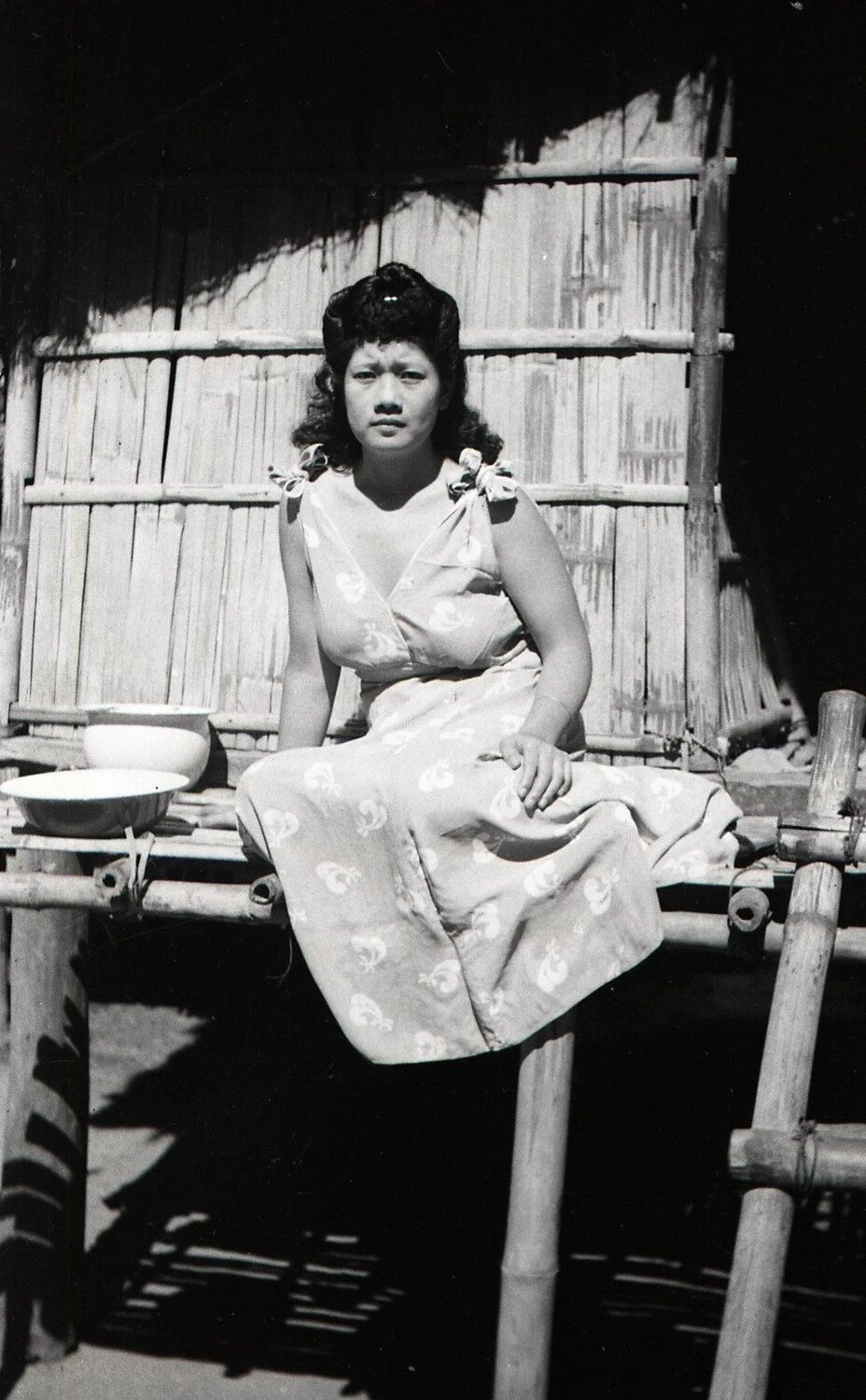 Portrait of a Young Filipina Woman on a Bamboo Platform, Luzon, Philippines, WWII Era