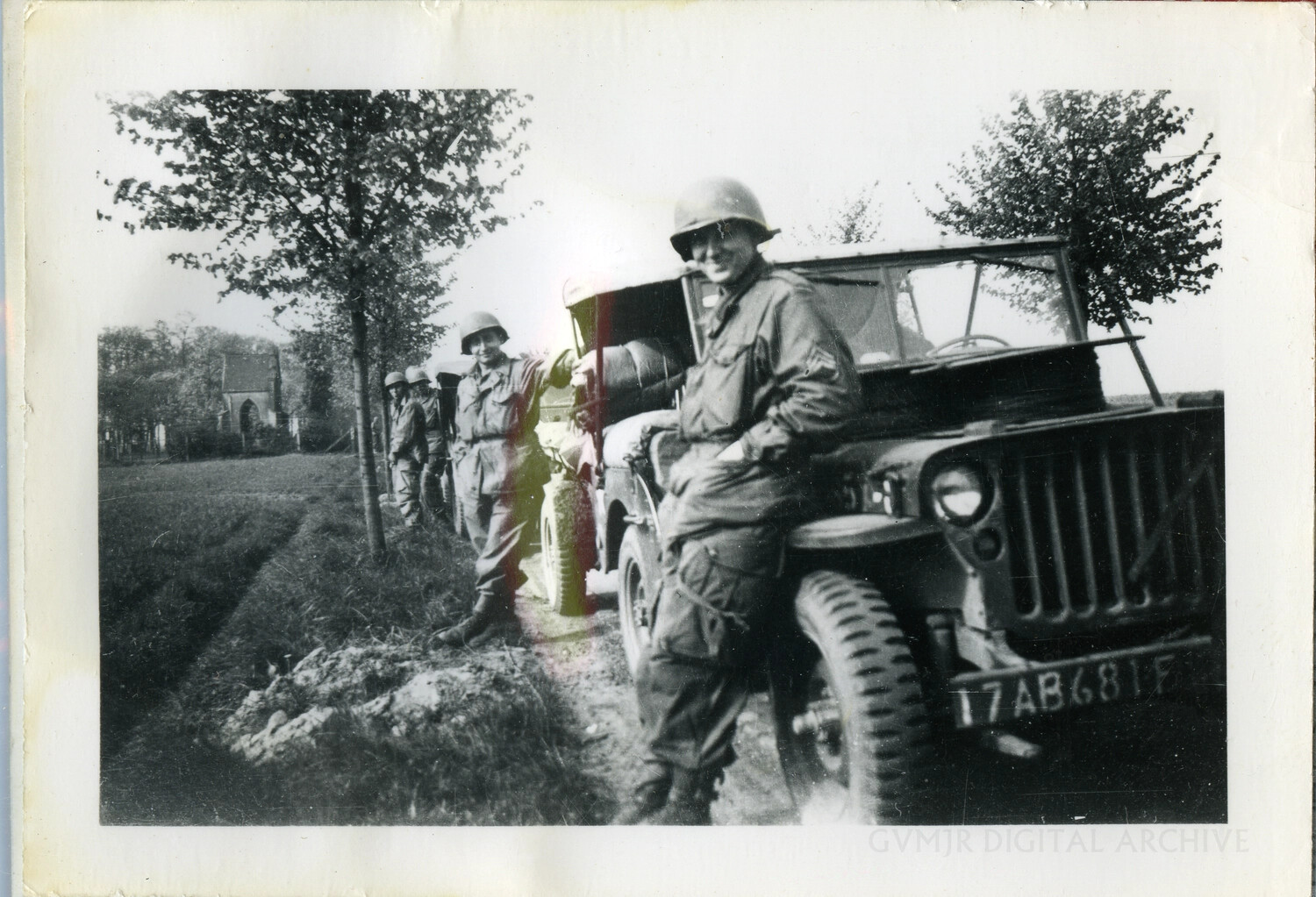 US Airborne Soldiers with Willys Jeep on Rural Tree-Lined Road, WWII European Theater