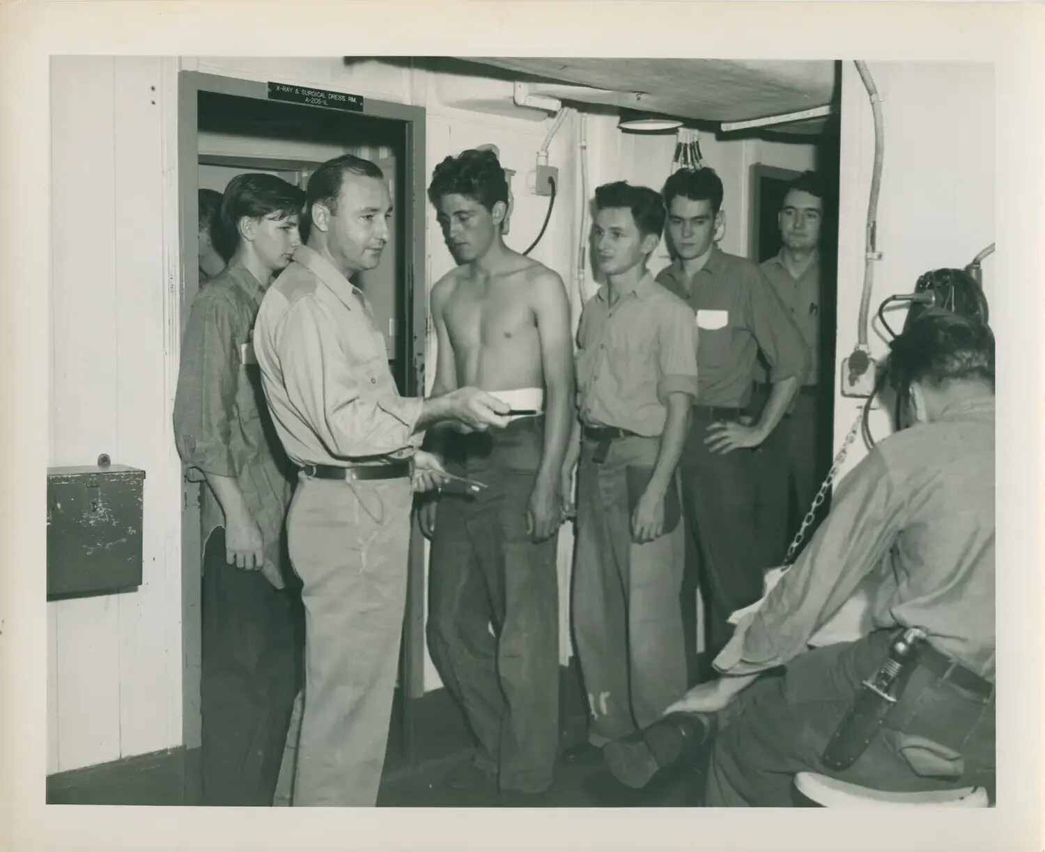 Sailors in Line for Medical Inspection Near X-Ray and Surgical Dressing Room
